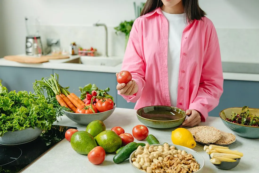 a person preparing a simple vegetable and grain meal in a home kitchen