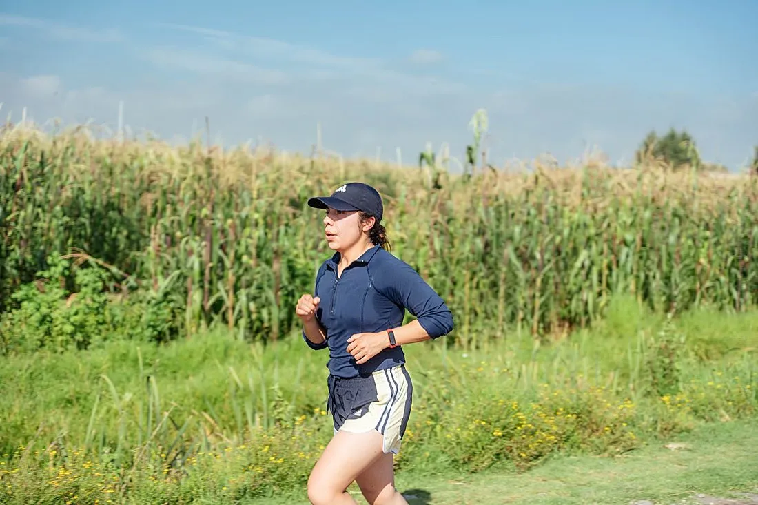 a woman brisk walking outdoors