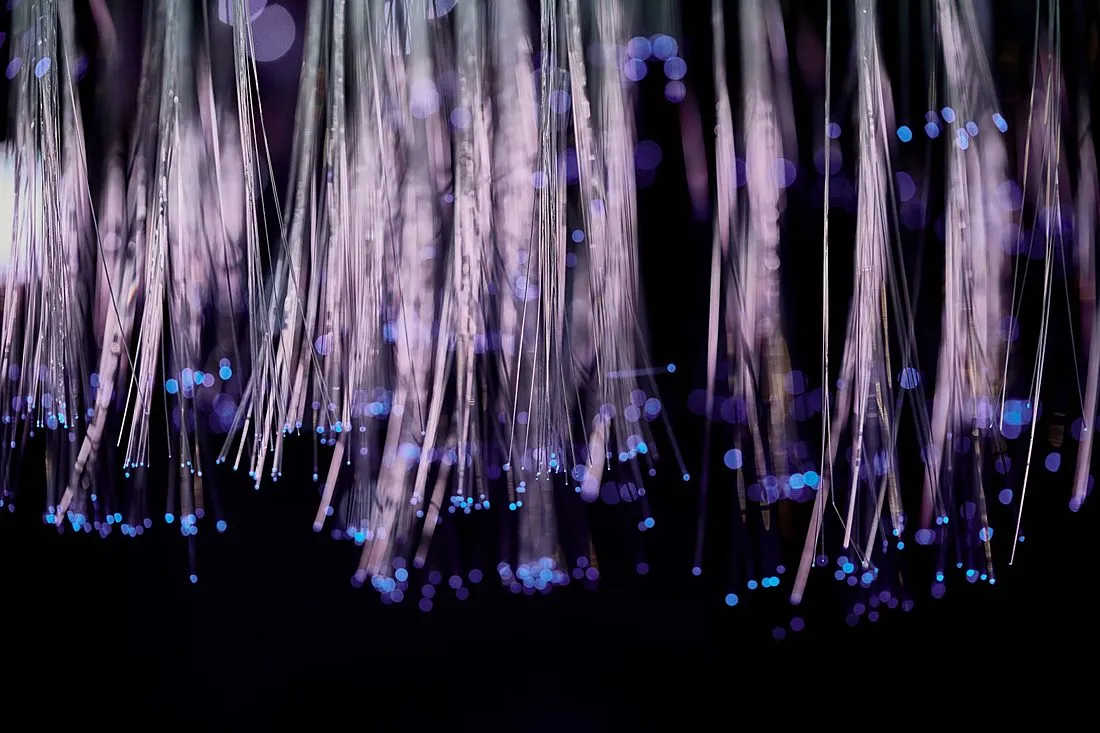 a fiber optic cable glowing with colored light