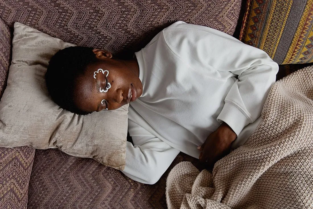 a person sleeping peacefully in bed