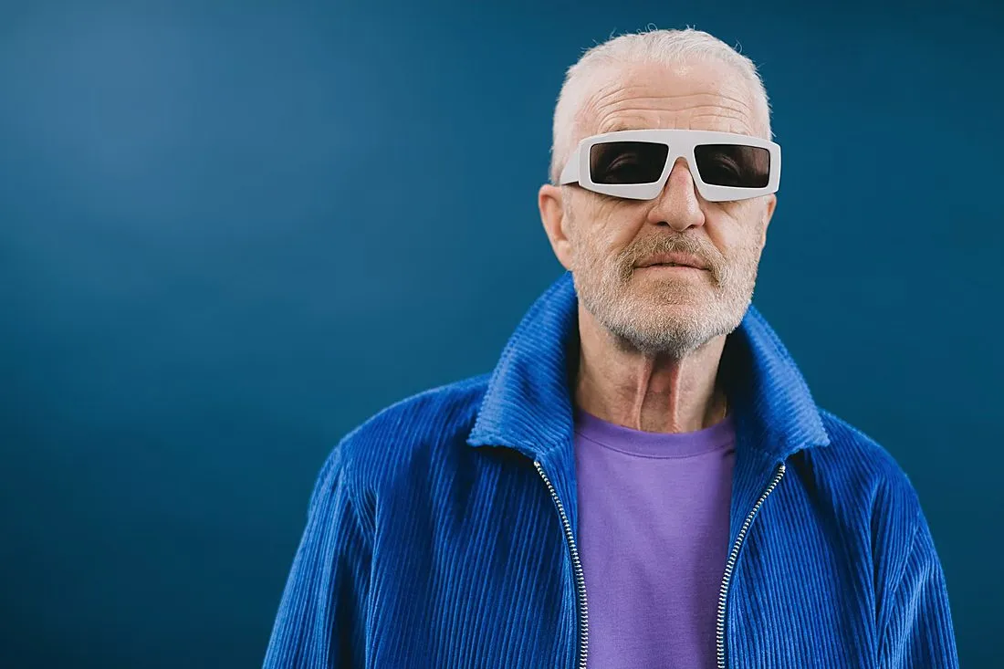 an elderly person wearing camera-mounted glasses