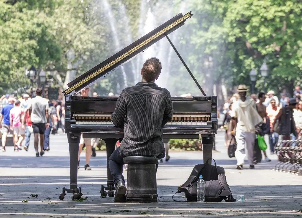 a man playing piano in a church
