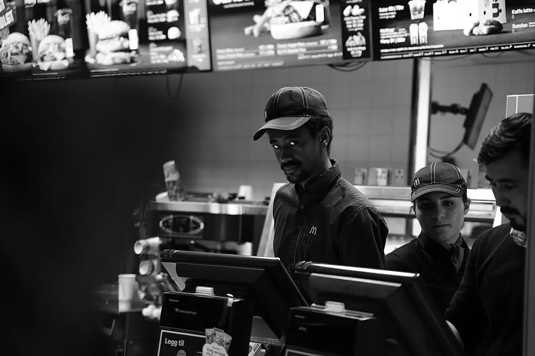 a young man in a Wendy's restaurant uniform