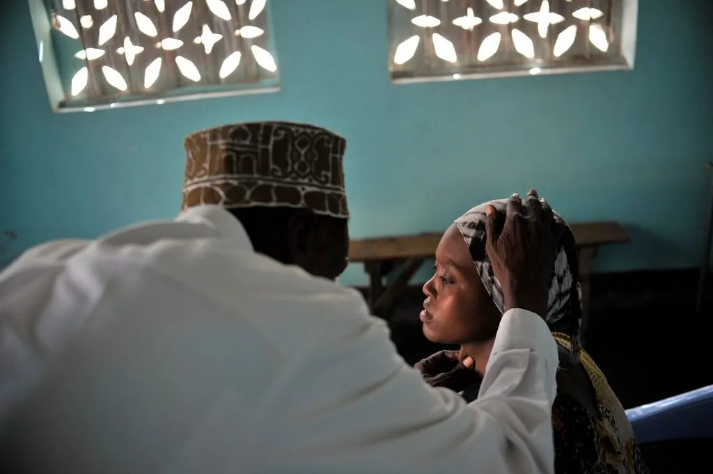 a doctor examining a patient's knee
