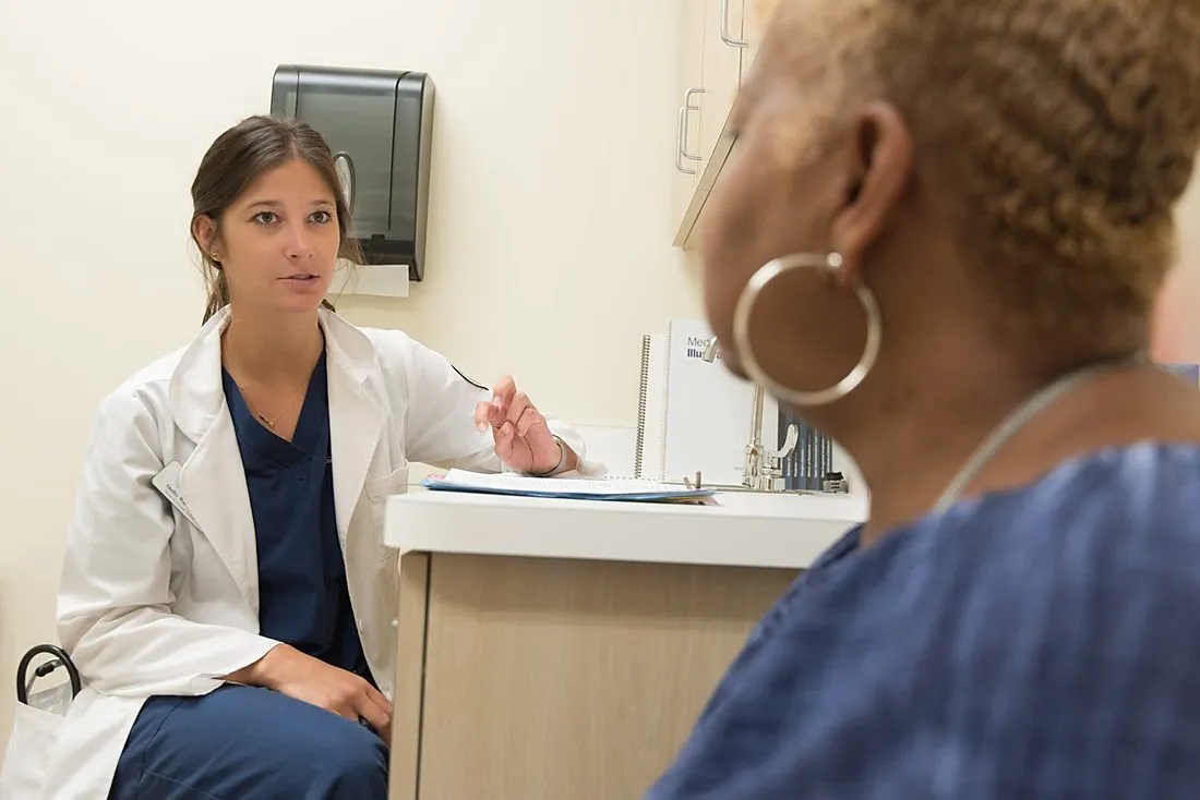 a nurse consulting with a patient at a community health clinic